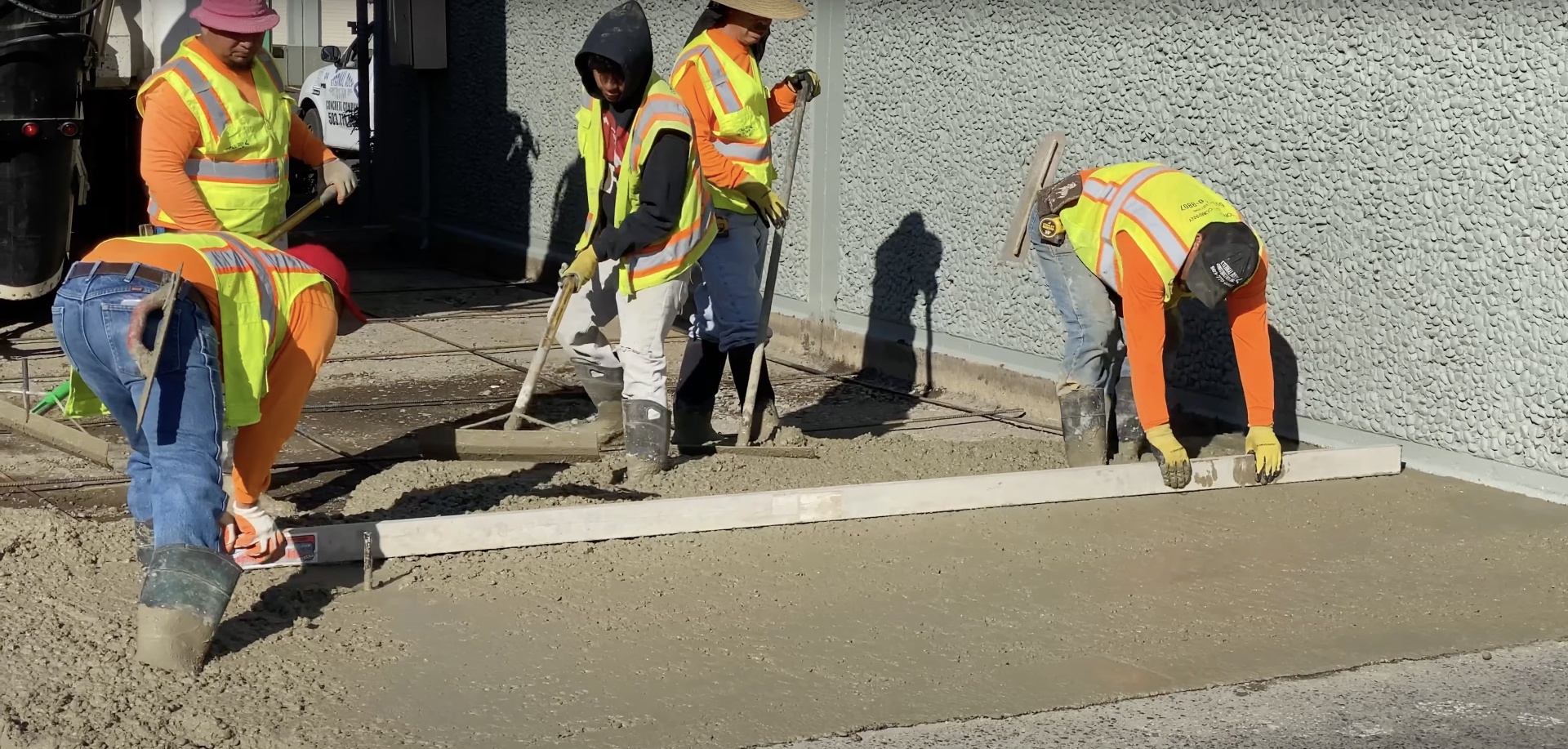 Commercial concrete crew performing professional sidewalk installation