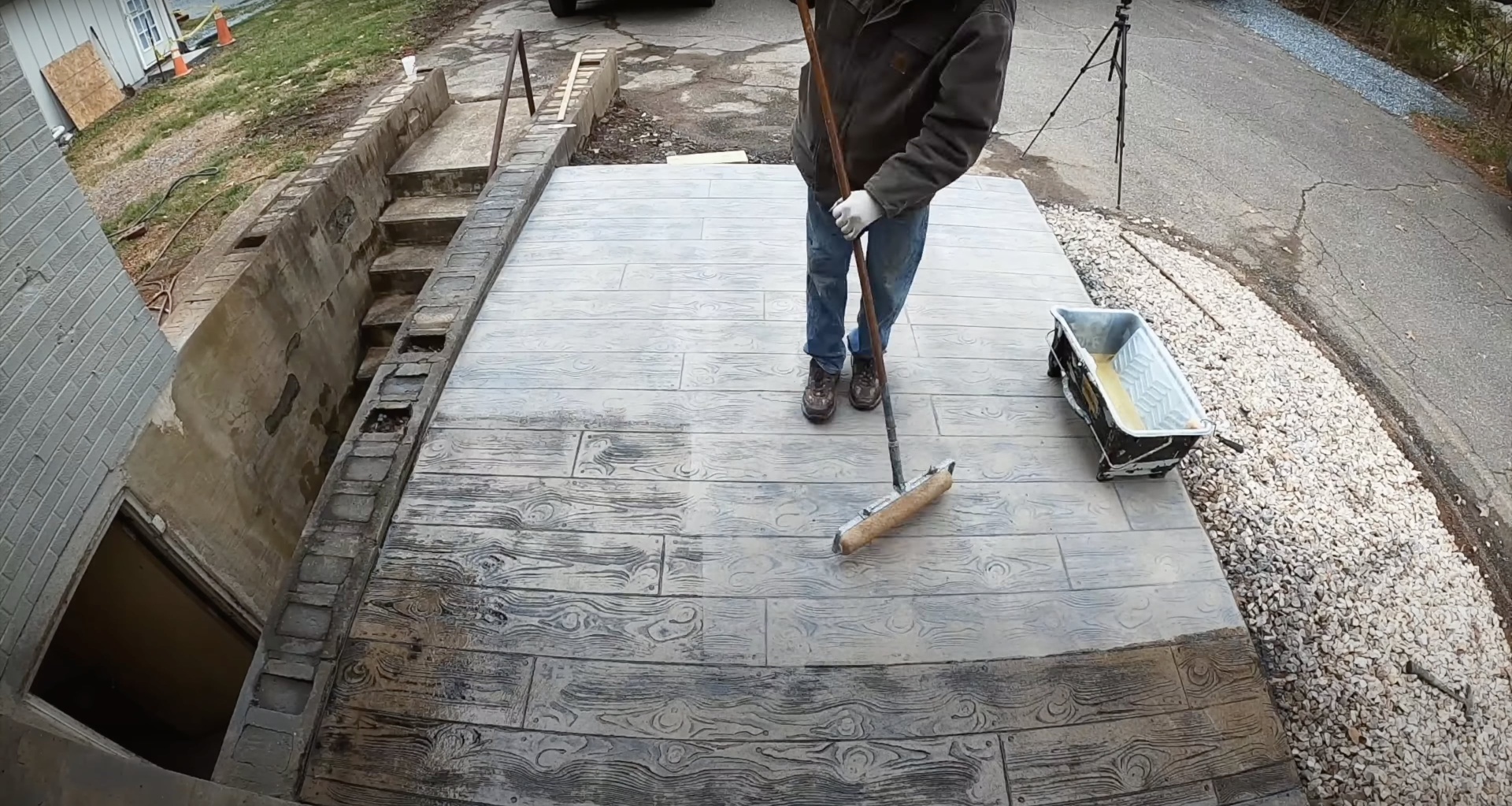 Stamped concrete patio with realistic wood grain pattern and texture