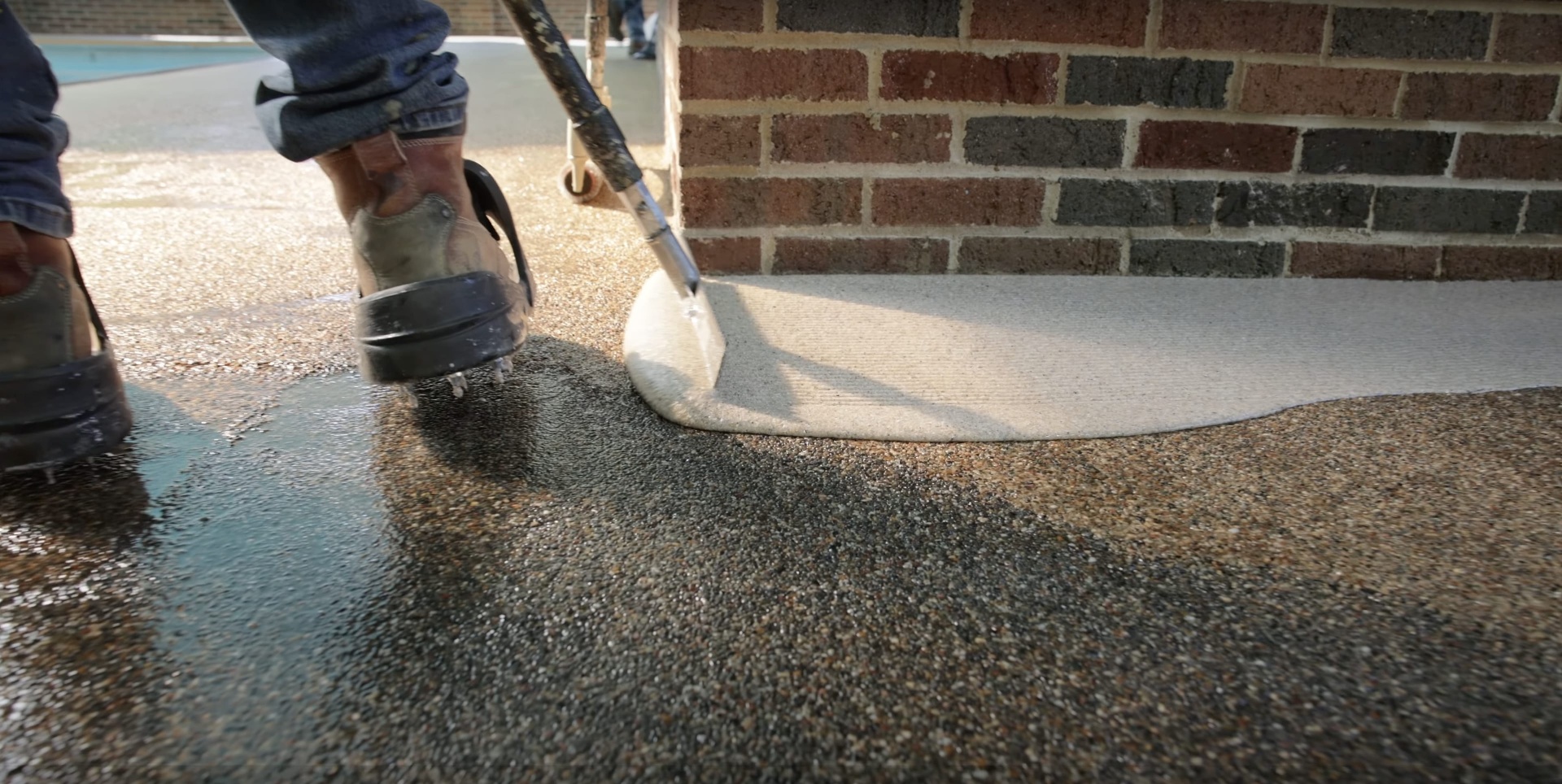 Fresh concrete being smoothed during installation