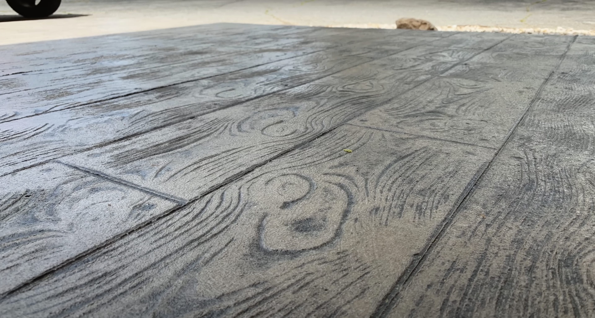 Close-up of stamped concrete with wood grain pattern